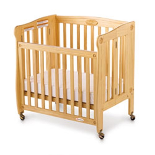 Crib with adjustable clearance side